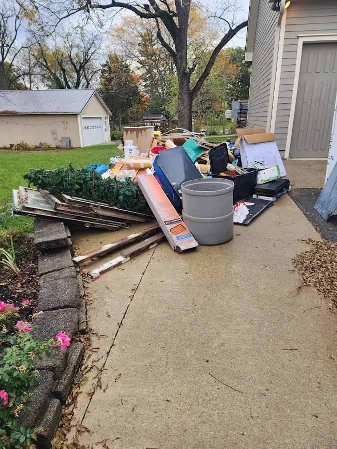 Dumpster being loaded with debris for 30 Yard Dumpster Rental in Josephine